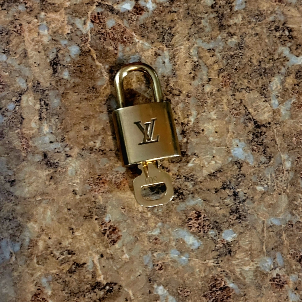 #304 Louis Vuitton padlock and key